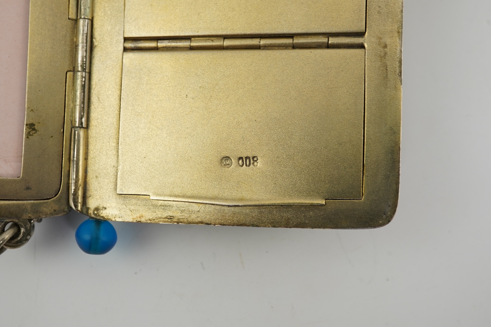 An early 20th century continental 800 standard silver combination, card, coin, aide memoir and pill case, with pencil and ribbed decoration, maker WK